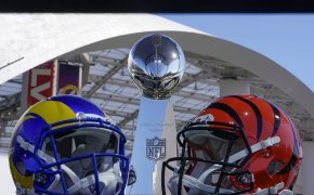 Rams and Bengals helmets next to the Lombardi Trophy