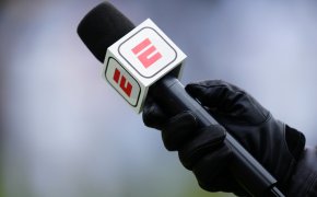 ESPN microphone hand holding black glove