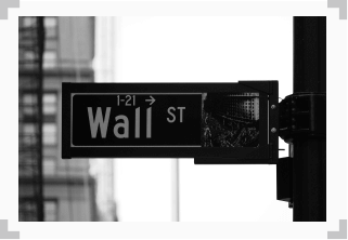 photo of street sign that says 'wall street'
